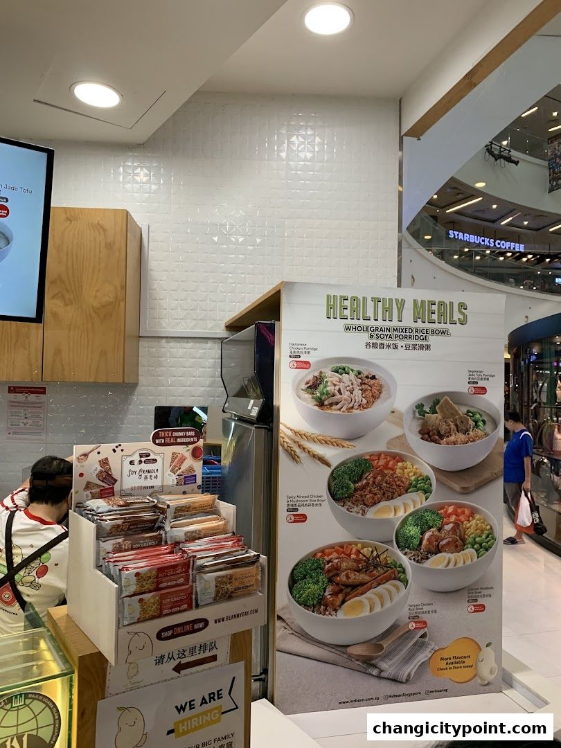 A display of healthy meal bowls and granola bars at a Mr Bean shop.