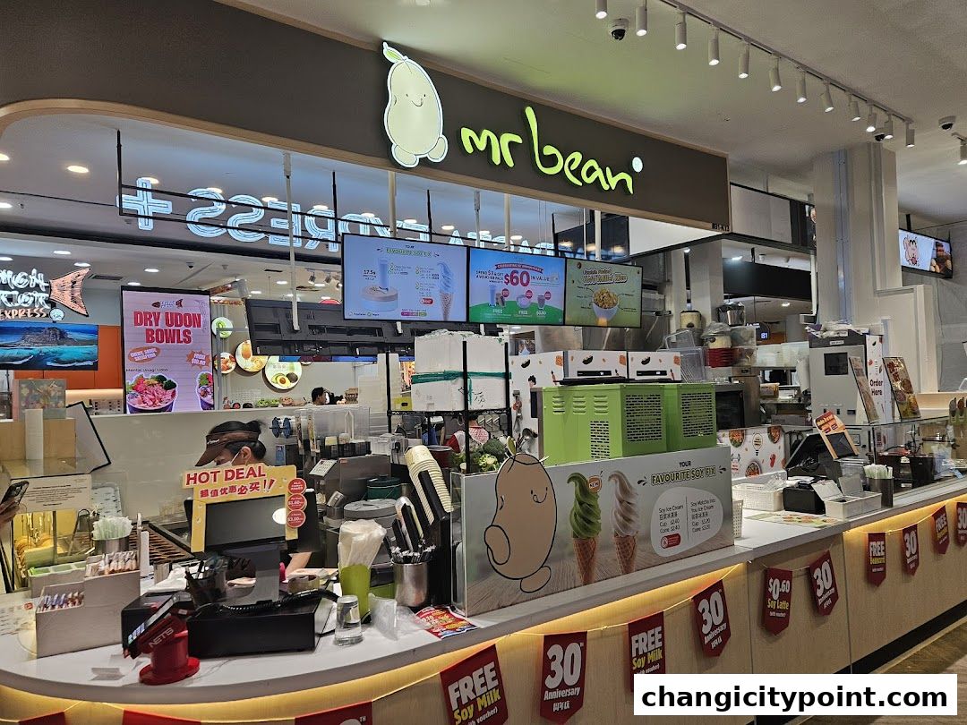 The Mr Bean shop counter with promotional displays and menu screens.