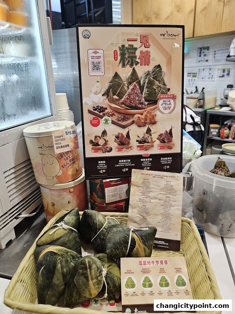 A display of various types of zongzi (rice dumplings) from Mr Bean, with a menu and product information.
