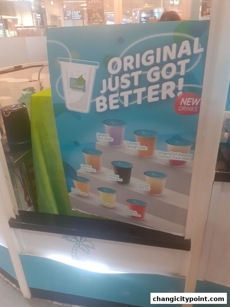A sign showcasing various new coconut-based drinks from Mr. Coconut.