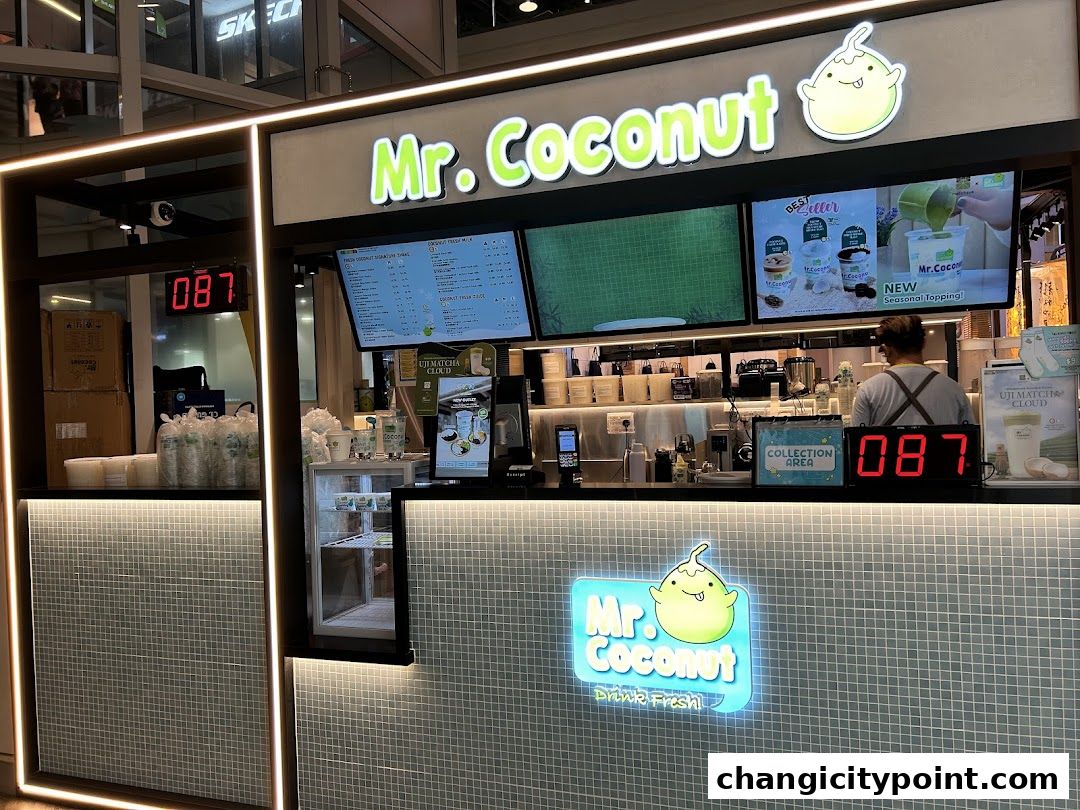 Mr. Coconut shop front with menu screens and a collection area.
