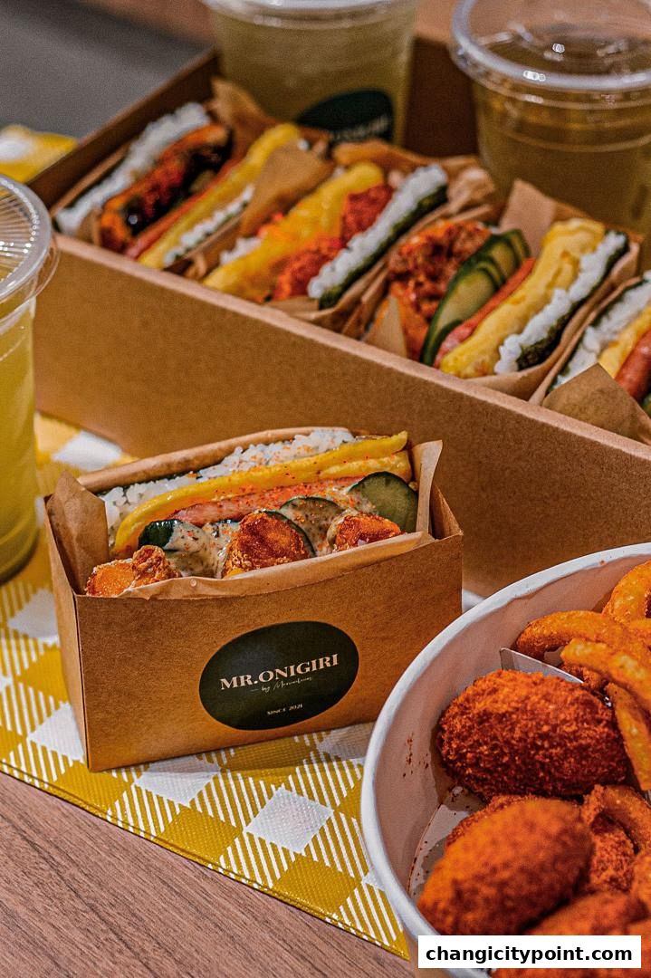 A close-up of delicious onigiri sandwiches and fried snacks from MR.ONIGIRI.