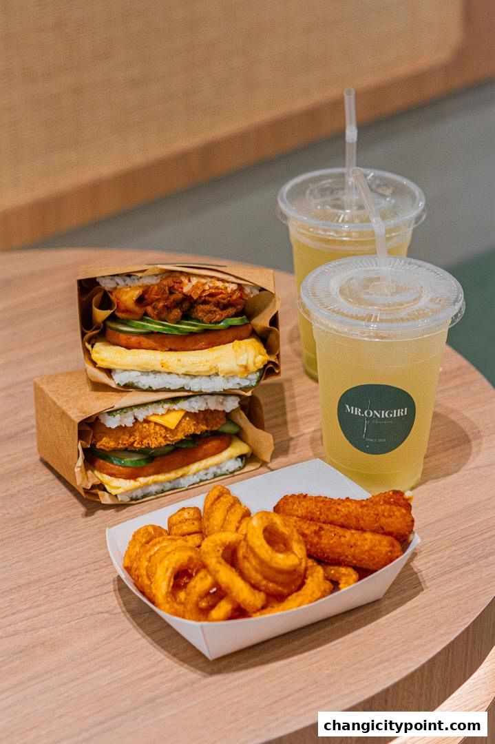 Two onigiri burgers and a side of fries with drinks from MR.ONIGIRI.