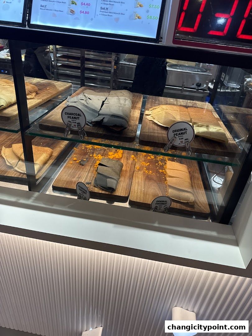 Display of various pancake flavors including charcoal peanut and original peanut.