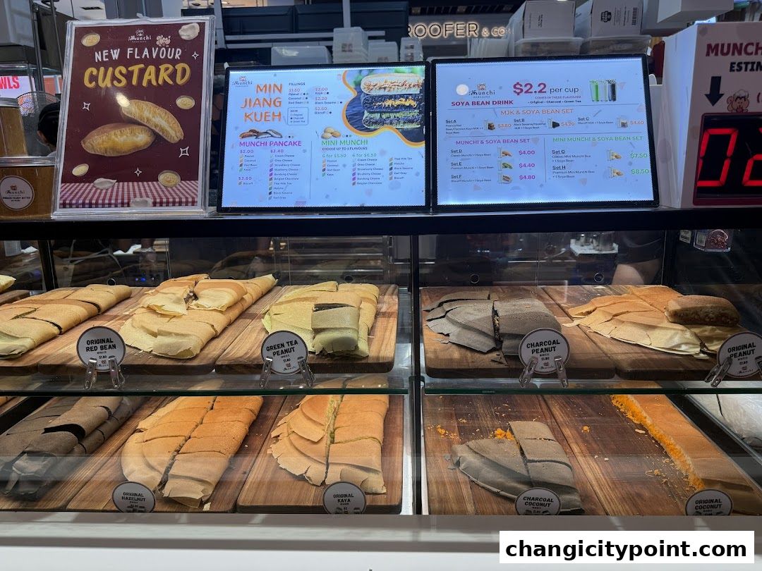 A display of various pancake flavors and drink sets at Munchi Pancakes.