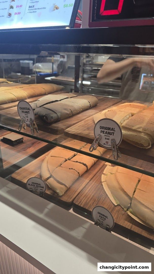 A display case filled with various flavors of pancakes at Munchi Pancakes.