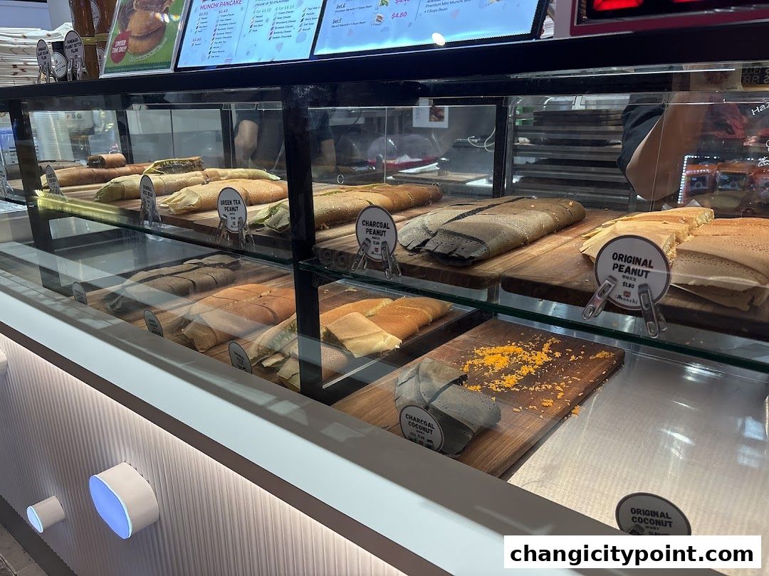 A display case filled with various flavors of pancakes at Munchi Pancakes.
