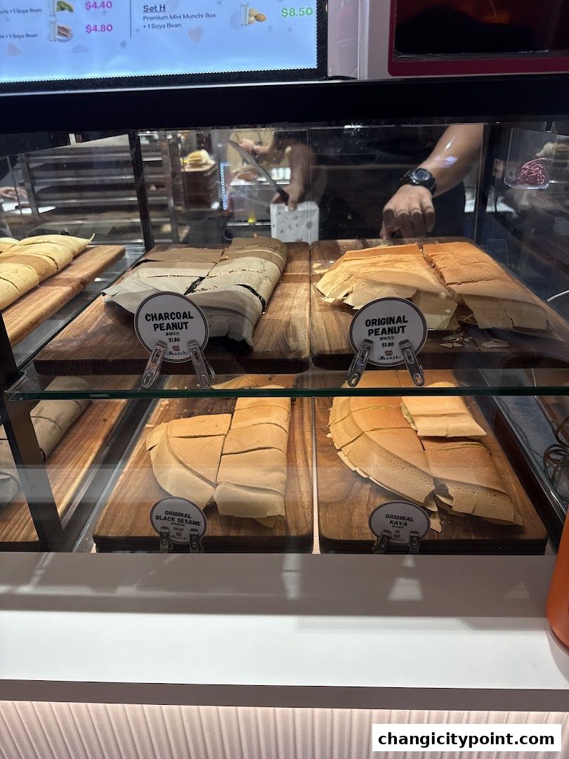 Display case filled with freshly made pancakes with various fillings.