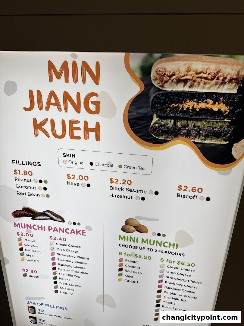 A menu board for Munchi Pancakes, showcasing various fillings and pancake options.