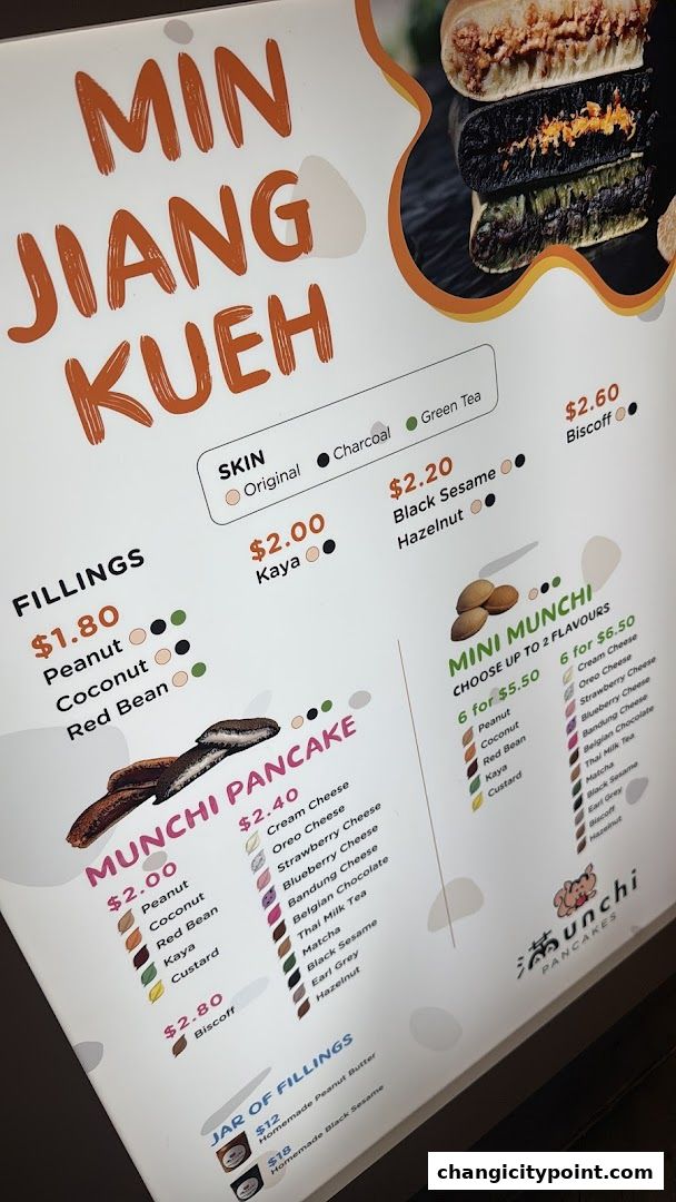 A menu board for Munchi Pancakes, showcasing various fillings and pancake options.