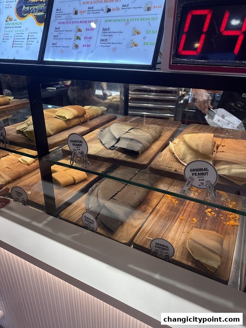 A display of various pancake sets and individual pancakes at Munchi Pancakes.