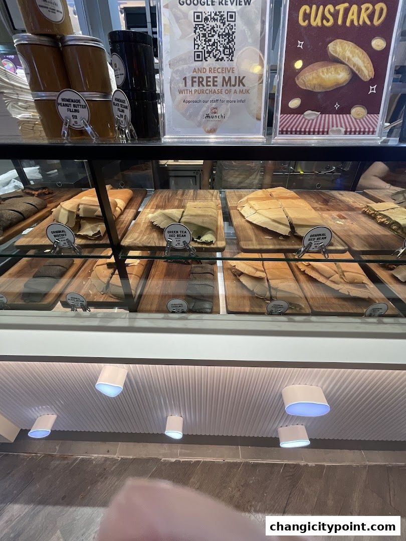 Display case filled with various pancake fillings and prepared pancakes.