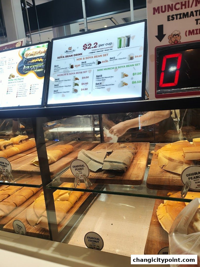 A display of various pancake flavors and drink sets at Munchi Pancakes.