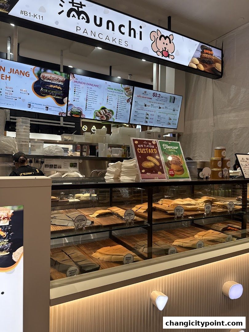 A display of pancakes and menu boards at Munchi Pancakes.