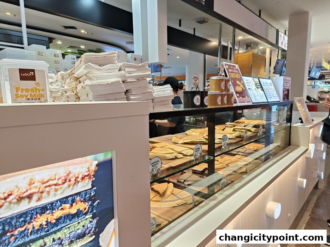 A display counter filled with various pancakes and soy milk at Munchi Pancakes.