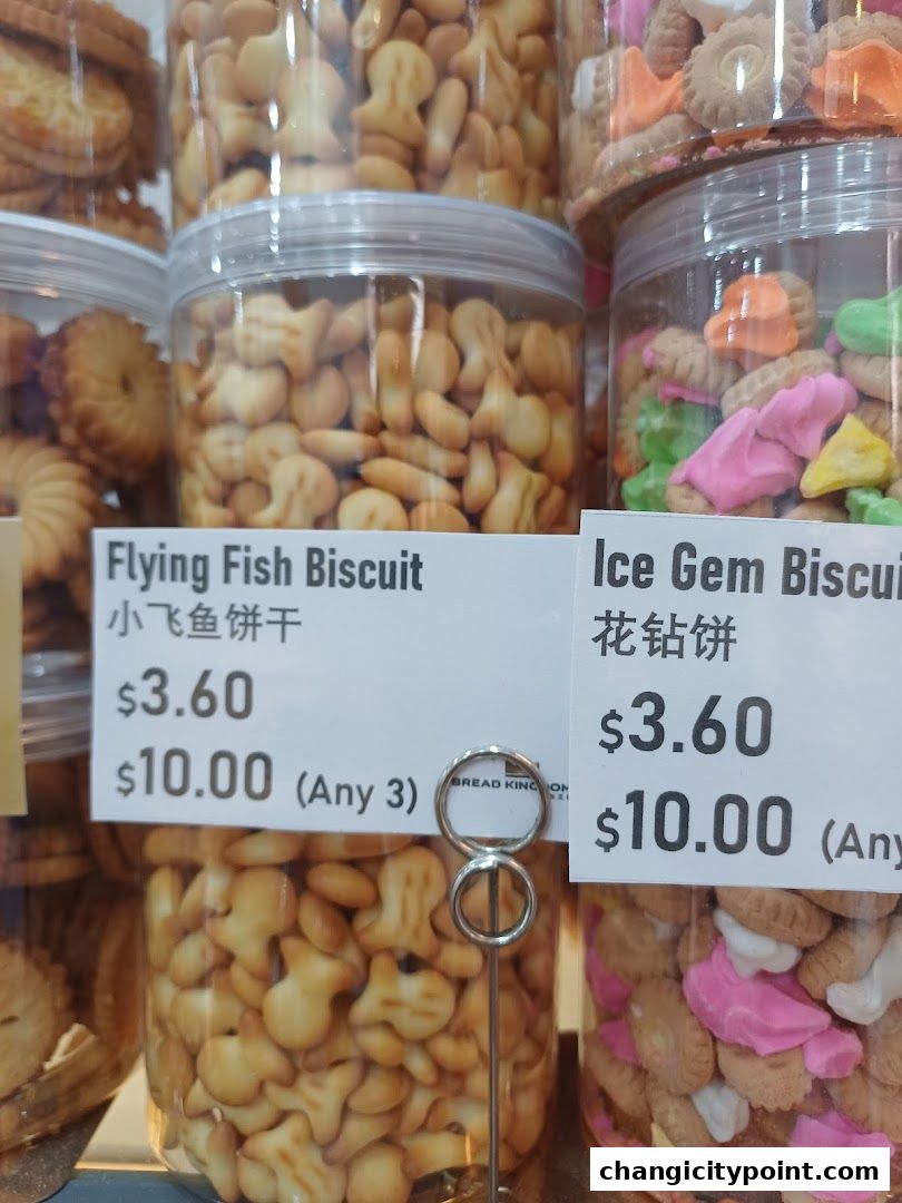 Jars of assorted biscuits, including flying fish and ice gem shapes, with price tags.