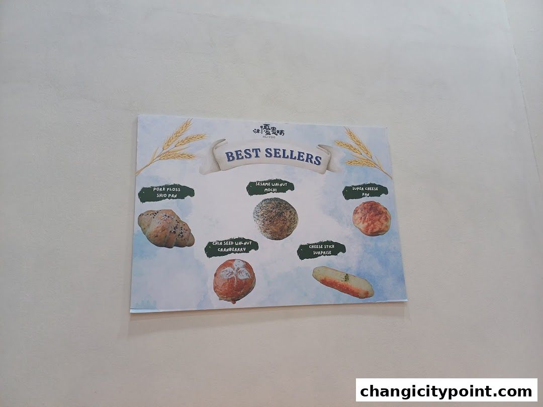 A sign displaying the best-selling baked goods from Muyoo Bakery.