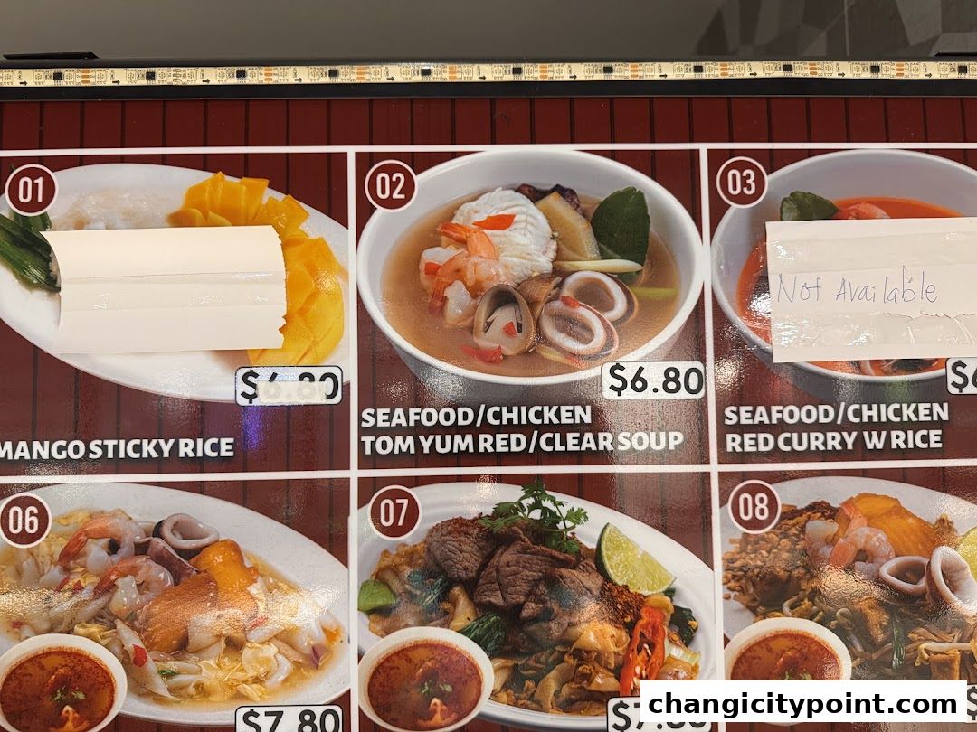 A menu display showing various Thai dishes with prices and images.
