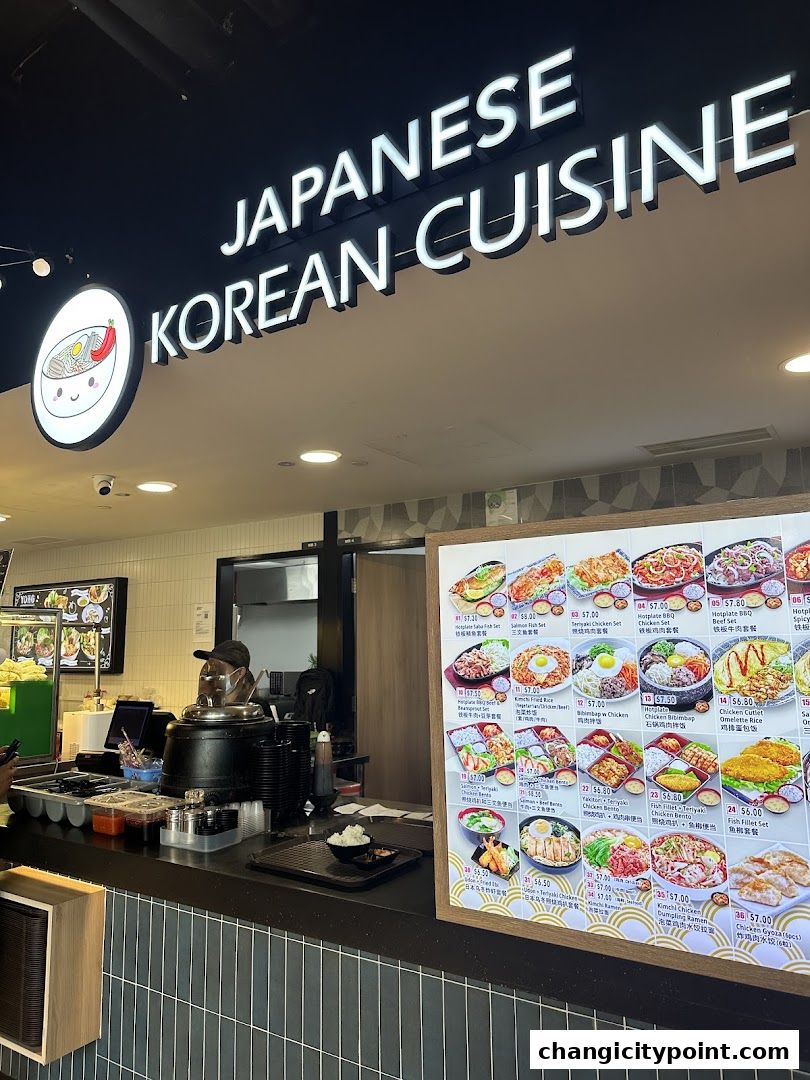 A shop front displaying a menu for Japanese and Korean cuisine with various dishes.