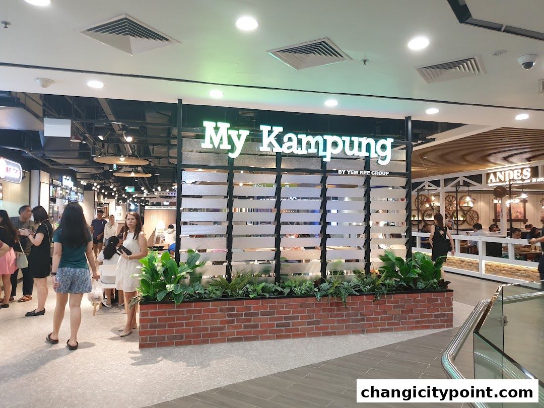 The exterior of the 'My Kampung' shop with people walking by.