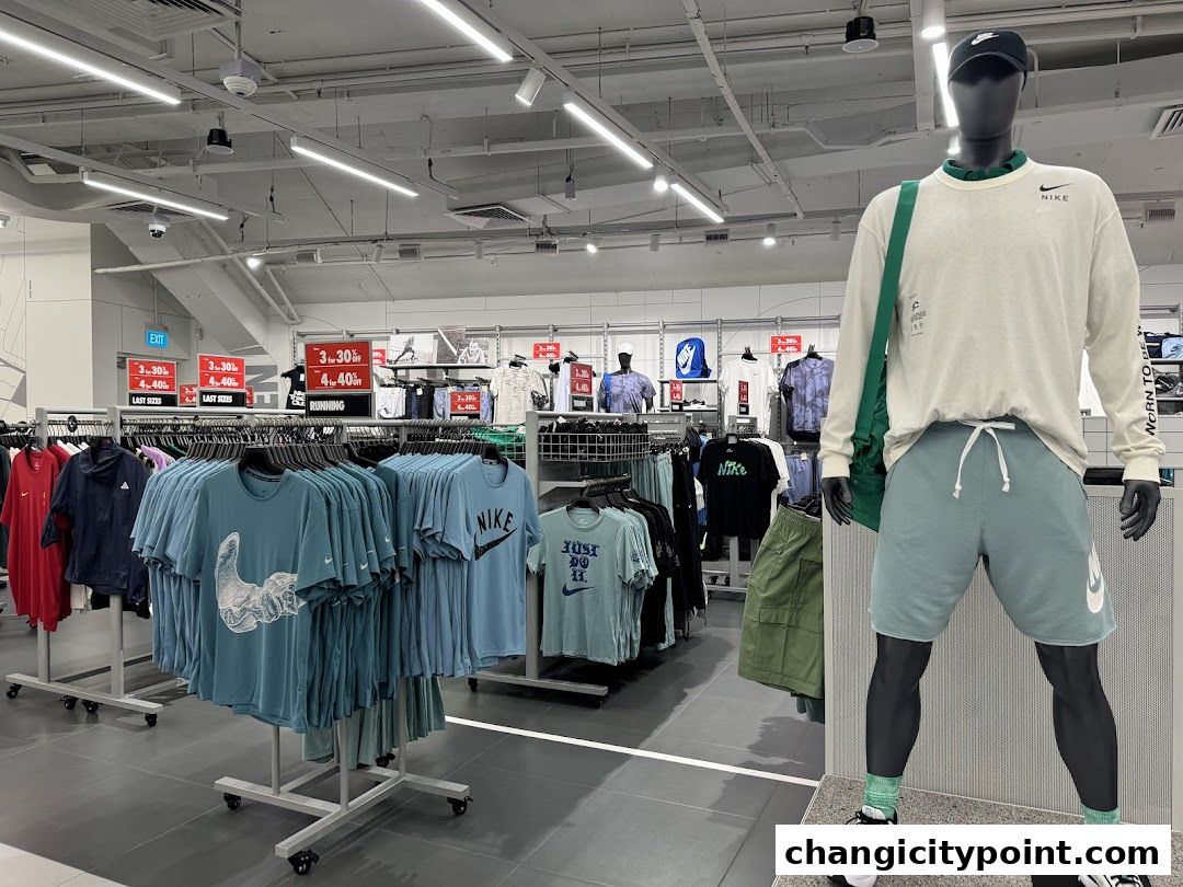 Interior view of a Nike Factory Store showcasing apparel and a mannequin.
