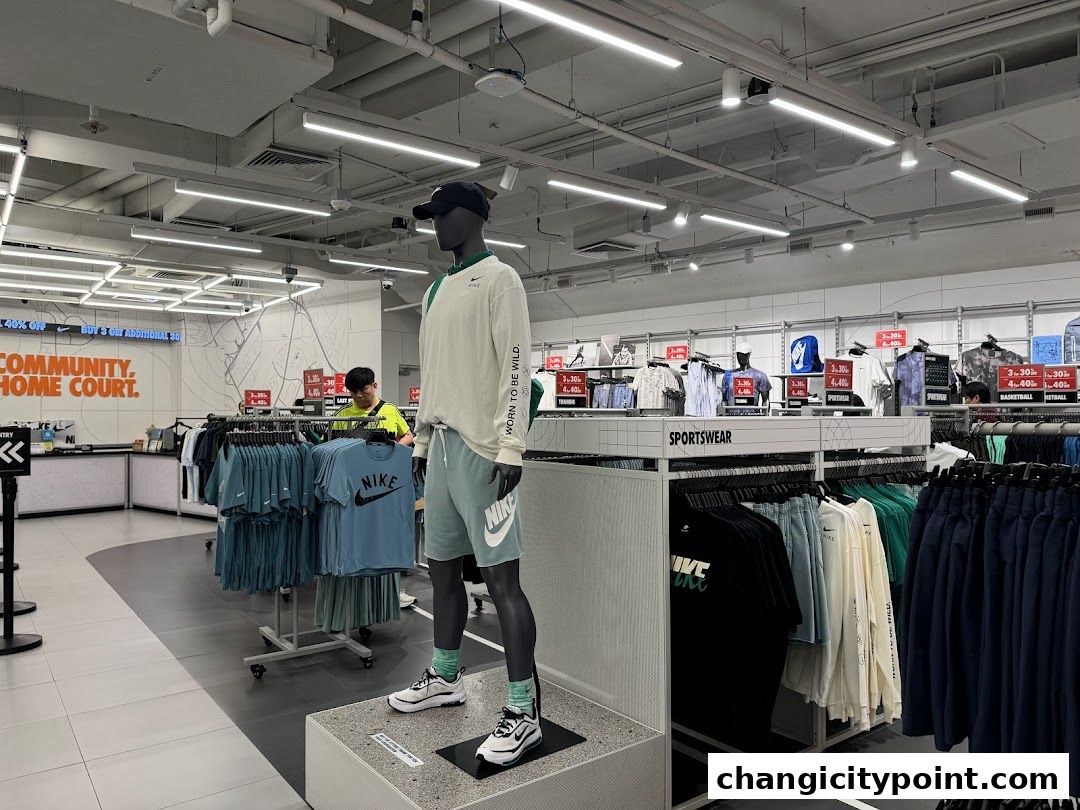 Interior of a Nike Factory Store with mannequins and sportswear displays.