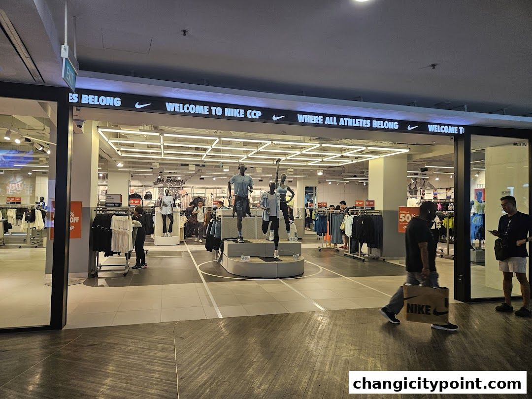 Entrance of the Nike Factory Store Changi City Point with mannequins and merchandise displayed.