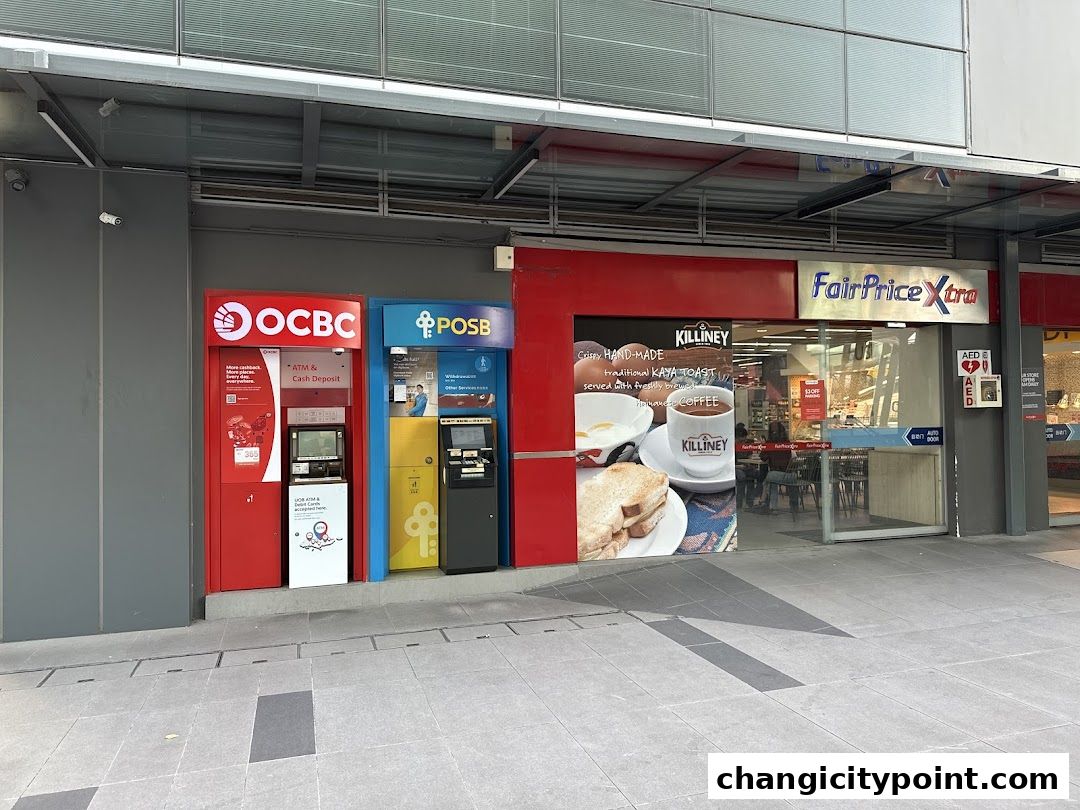 OCBC and POSB ATMs are located next to a FairPrice Xtra supermarket with a Killiney Kopitiam advertisement.