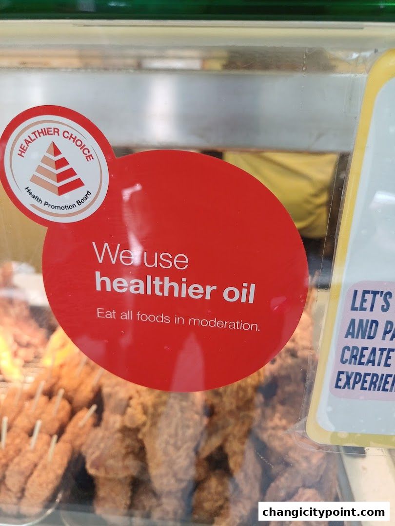 Old Chang Kee advertises using healthier oil with a Healthier Choice sticker.