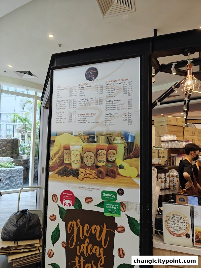 A menu board for Old Tea Hut Changi City Point displaying various tea, coffee, and beverage options.