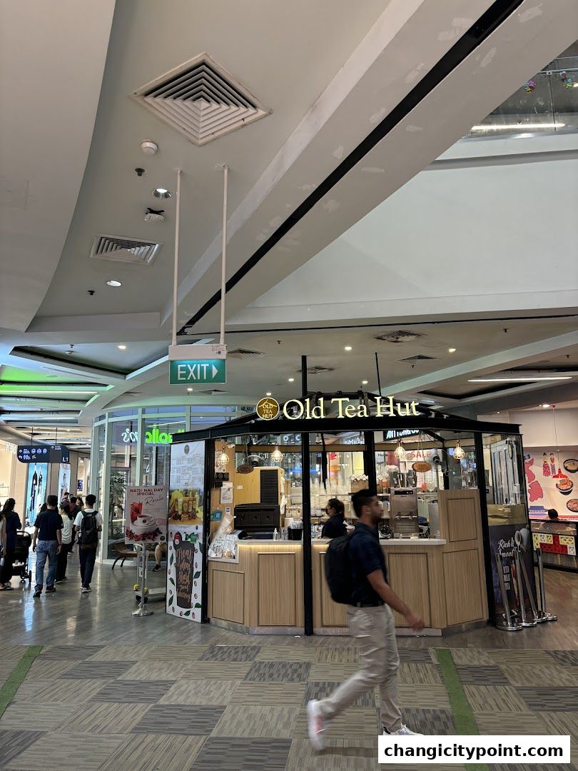 The Old Tea Hut shop front in a mall, with customers and staff visible.