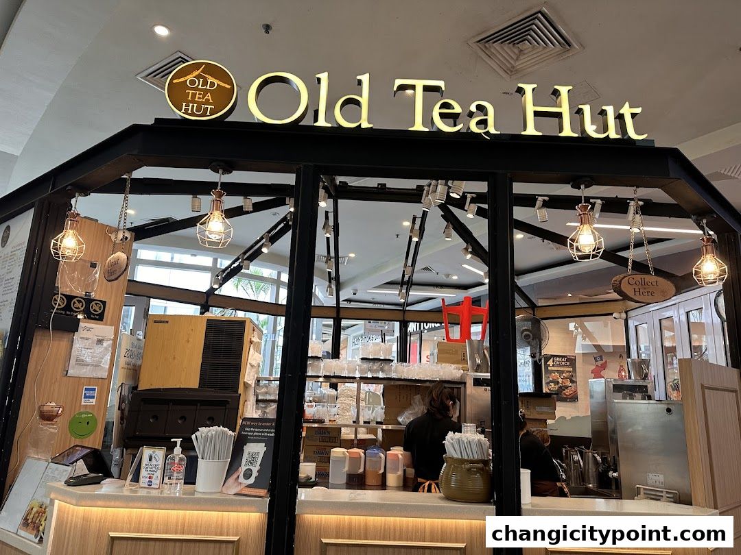 The exterior of the Old Tea Hut shop with its prominent signage and inviting interior.