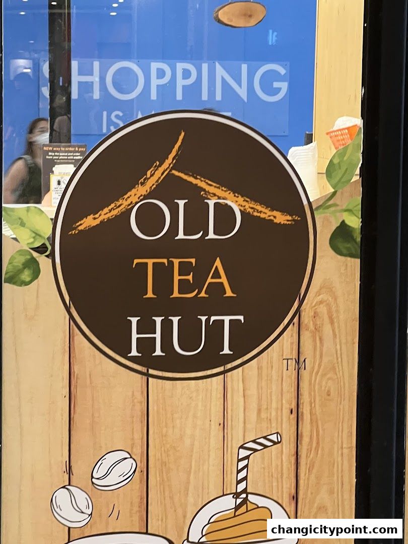 The logo of Old Tea Hut featuring a stylized mountain and tea cup.
