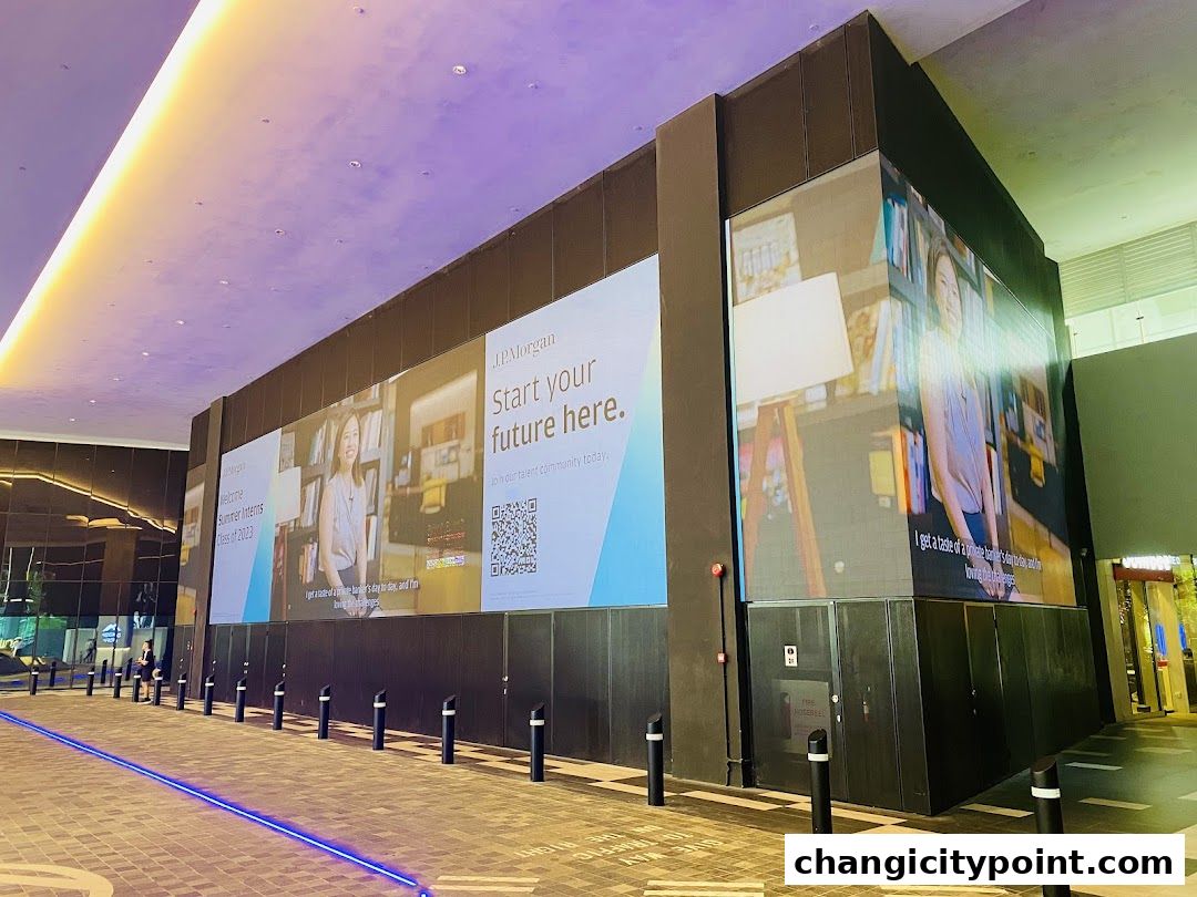 Large digital billboards display advertisements for JPMorgan's summer internship program.
