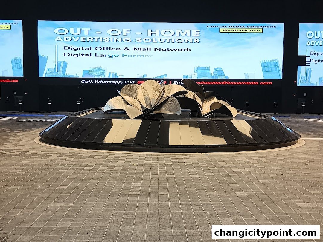 Large digital billboards display advertising solutions with contact information.