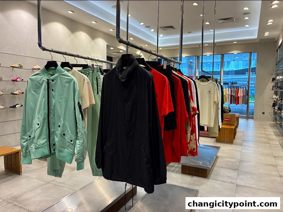 Interior view of Onitsuka Tiger Changi Citypoint store showcasing apparel and footwear.