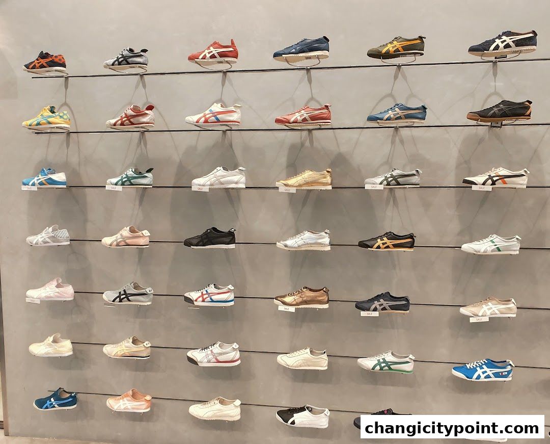A wall display showcasing a wide variety of Onitsuka Tiger sneakers in different colors and styles.
