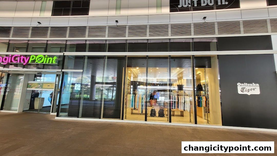 The exterior of the Onitsuka Tiger store at Changi Citypoint, showcasing apparel and accessories.