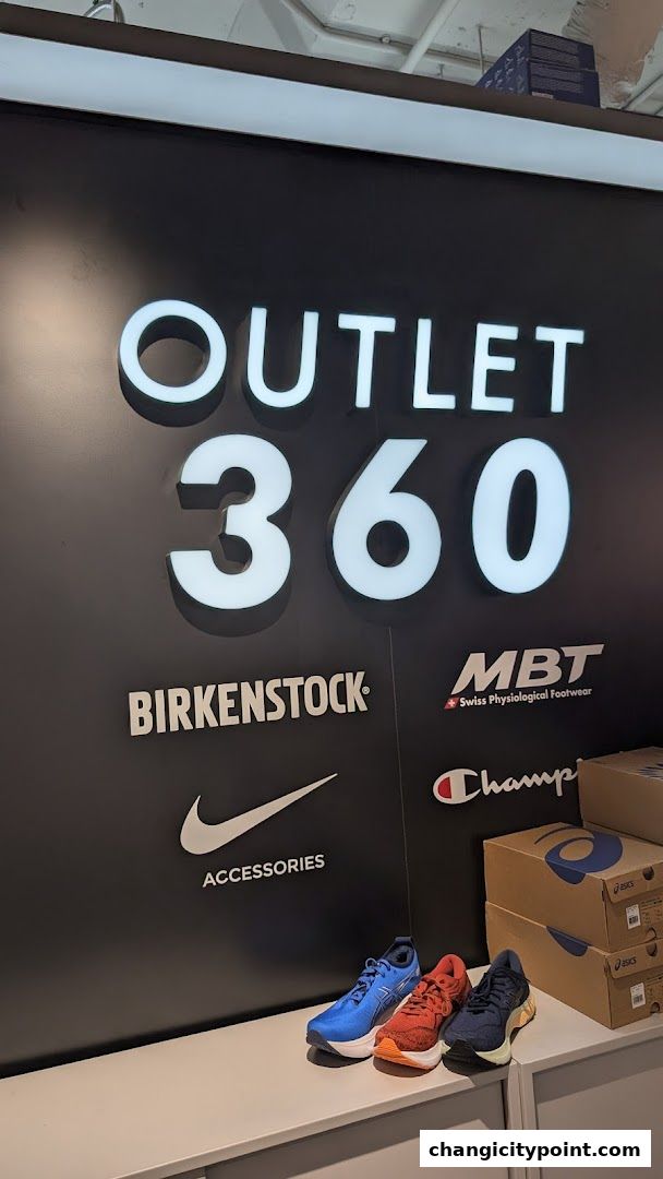 Outlet 360 store sign with brands like Nike, Birkenstock, MBT, and Champion.