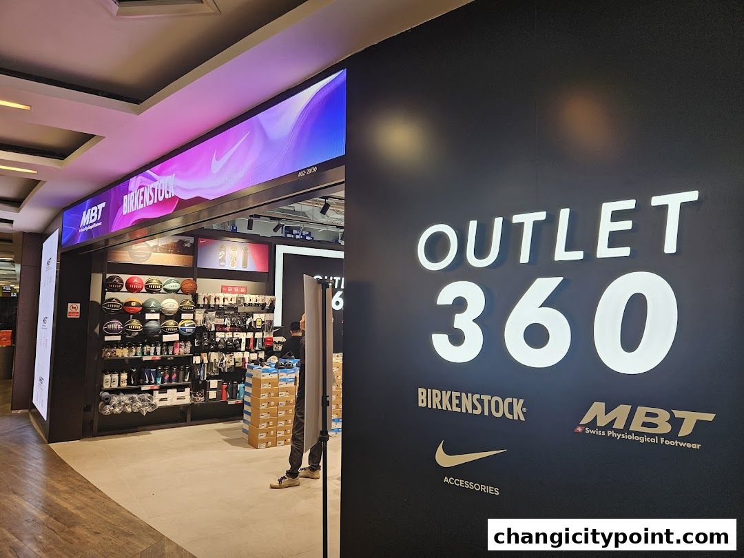 Outlet 360 shop front displaying various sports accessories and footwear brands.