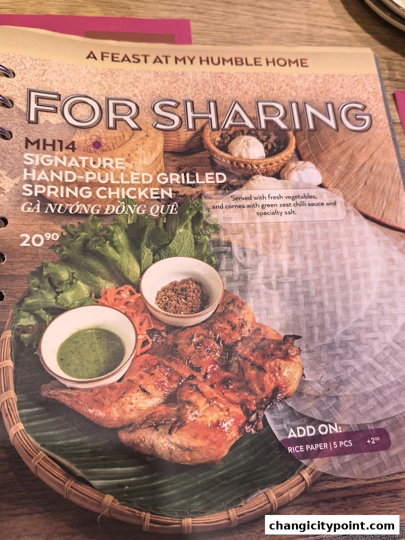 A menu page featuring a signature hand-pulled grilled spring chicken dish.