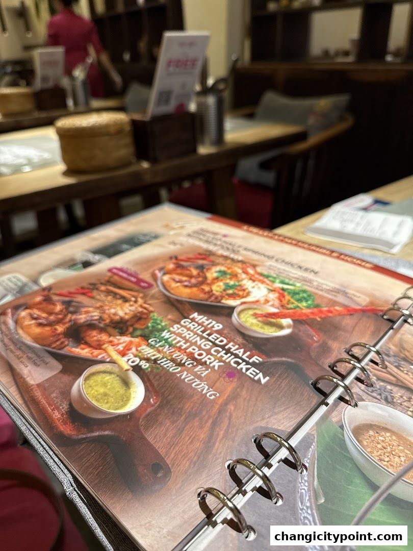 A menu page showcasing grilled half spring chicken with pork.