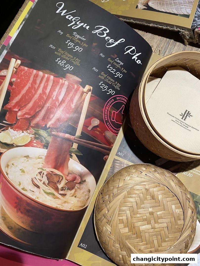 A menu featuring Wagyu Beef Pho with different portion sizes and prices.