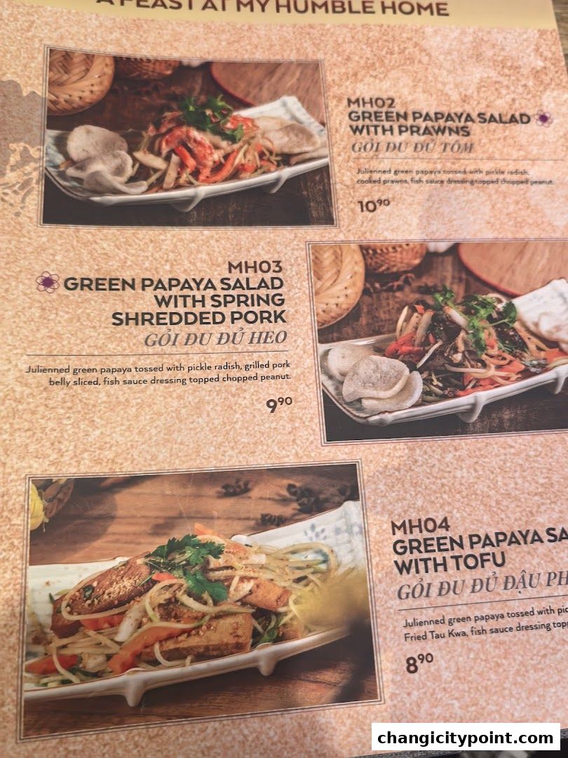 A menu page showcasing three different green papaya salad dishes with various toppings.