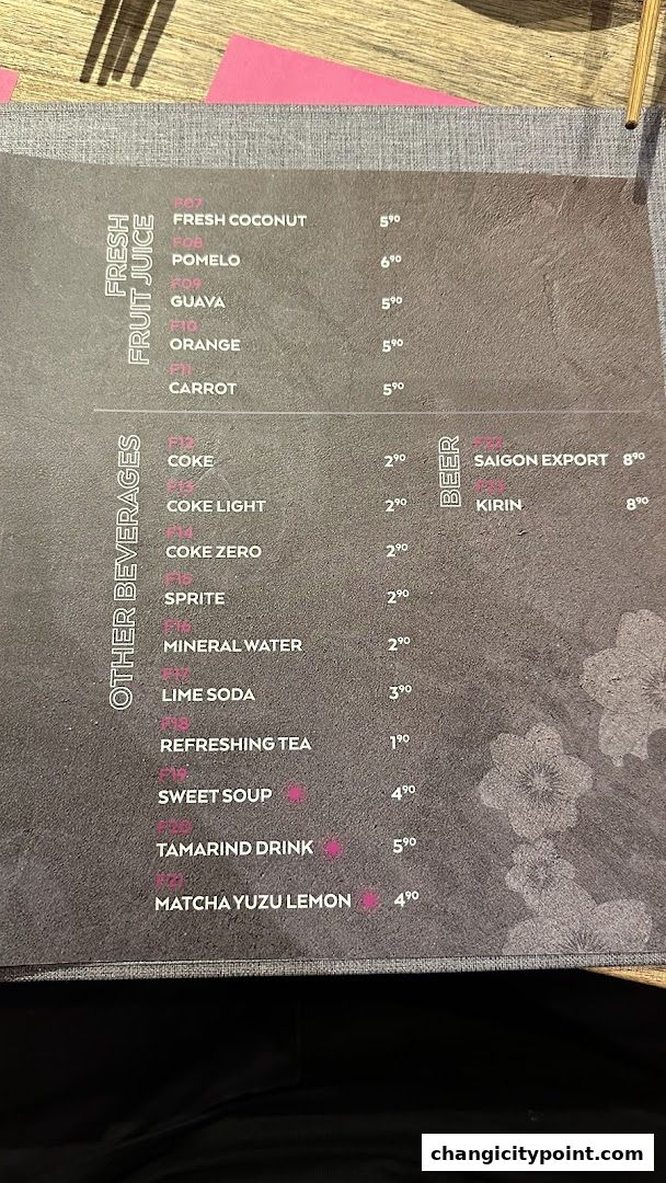 A menu displaying fresh fruit juices, other beverages, and beers with prices.