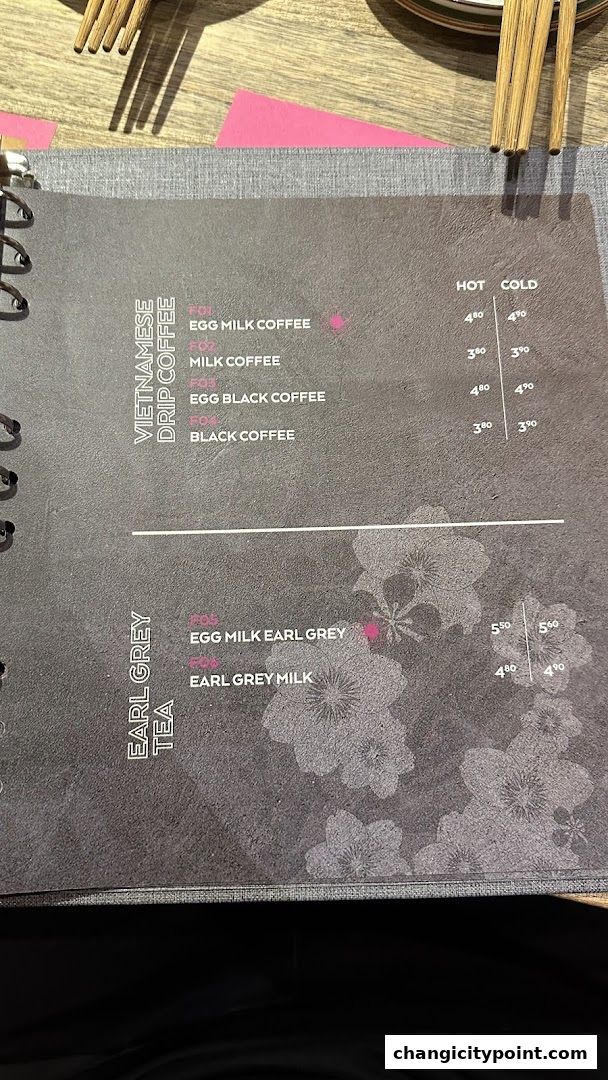 A menu page showing Vietnamese drip coffee and Earl Grey tea options with prices.