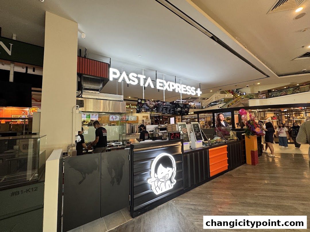 The Pasta Express shop front with staff preparing food and customers nearby.