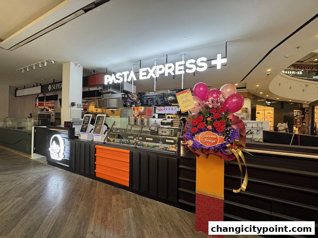 Pasta Express shop front with a floral arrangement and balloons.