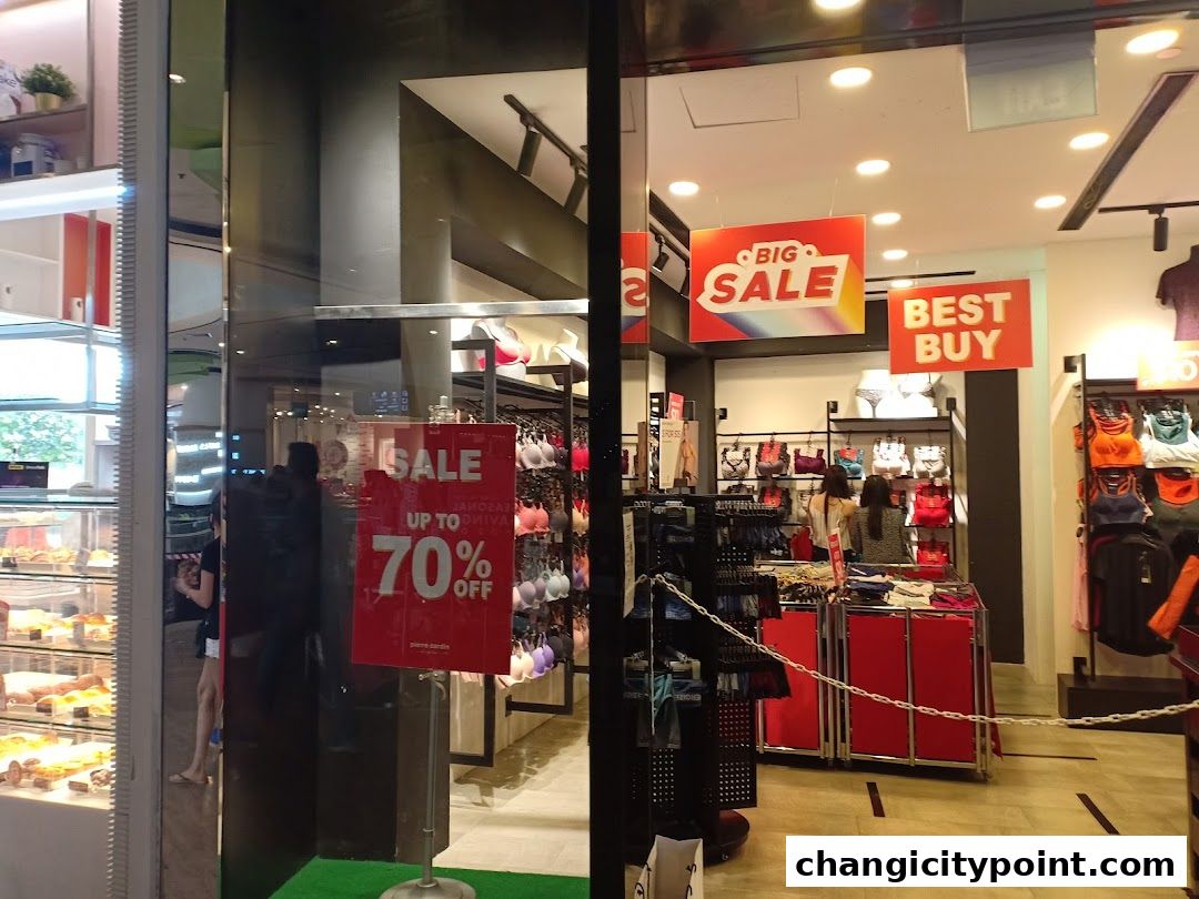 Pierre Cardin Lingerie shop with sale signs and displays of lingerie.