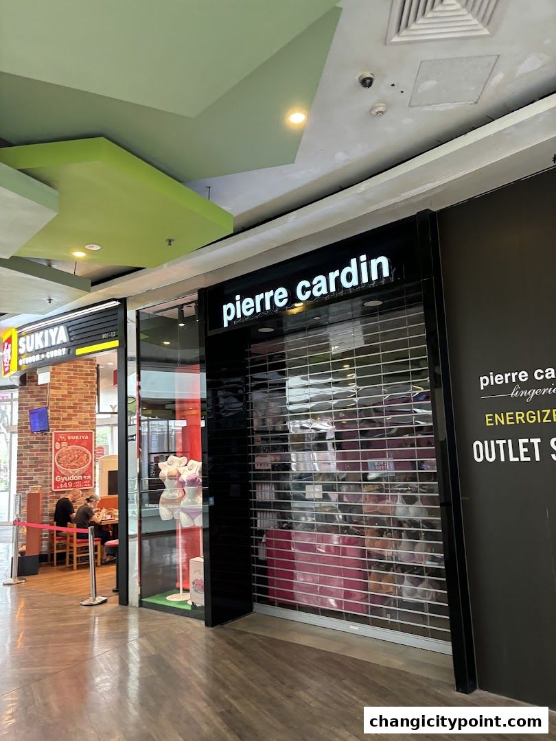 Pierre Cardin Lingerie shop front with mannequins and closed shutters.
